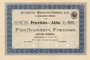Ein altes deutsches Aktienzertifikat mit einem blauen Rand und der Aufschrift "Schweiz Wagons-Fabrik A.G."