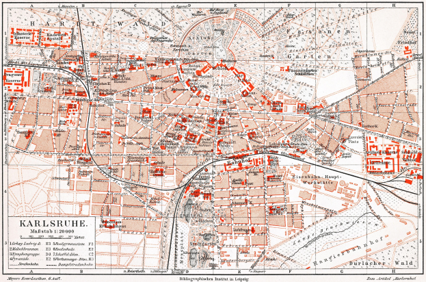 Ein detaillierter alter Stadtplan von Karlsruhe, Deutschland aus dem Jahr 1900, mit Text und umfassender Stadtübersicht.